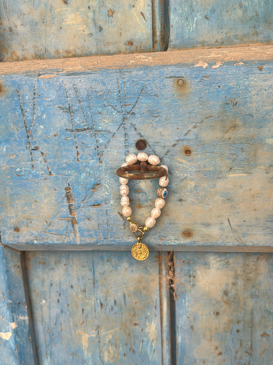 The Aegean Pearl Eleni With a Coin