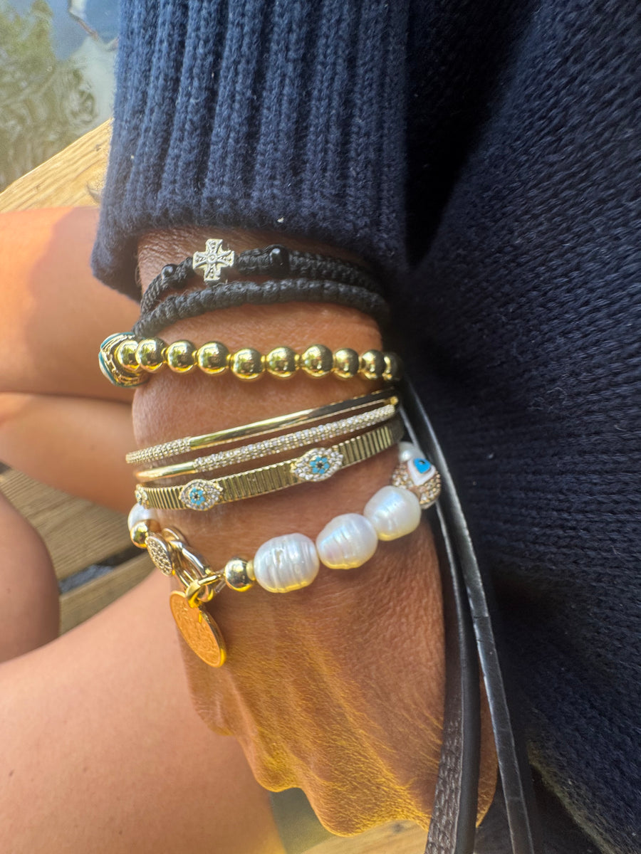 The Aegean Pearl Eleni With a Coin