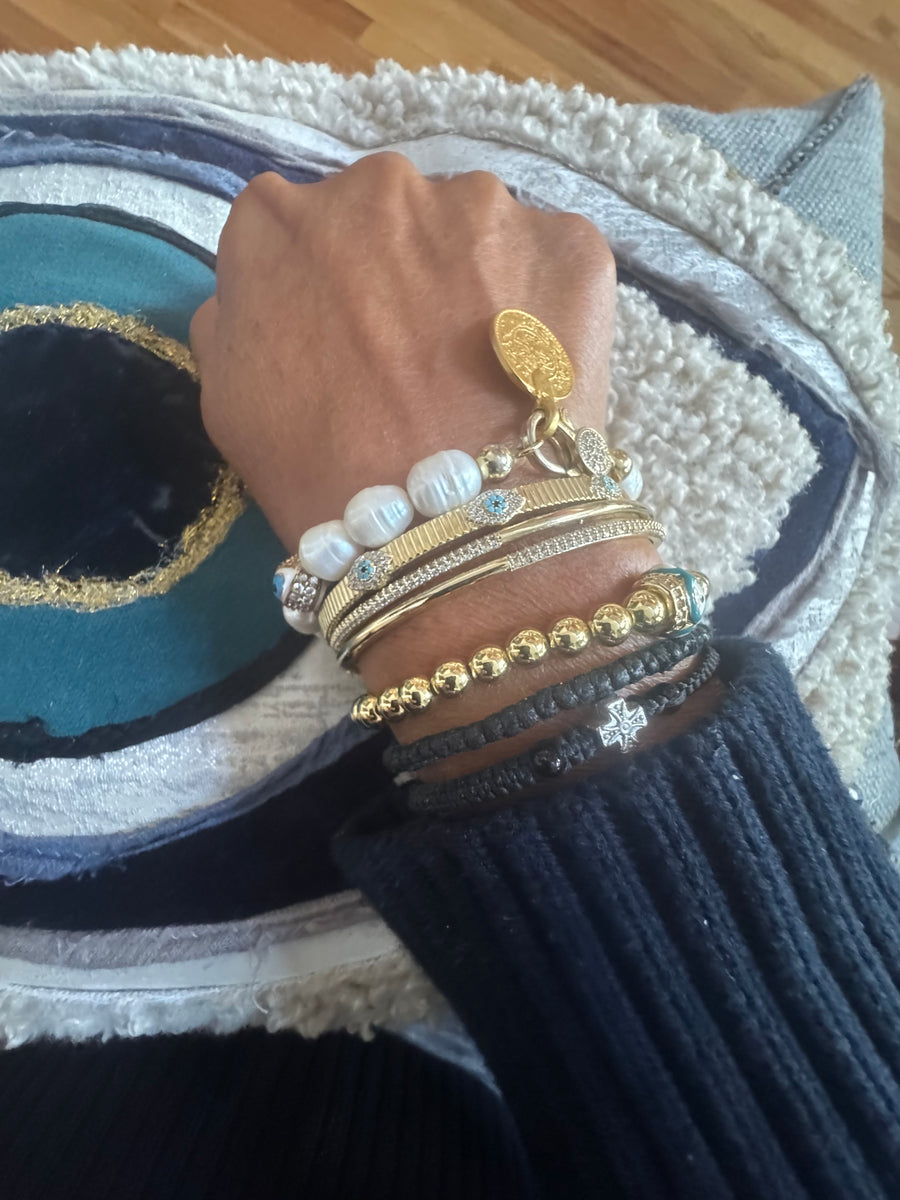 The Aegean Pearl Eleni With a Coin