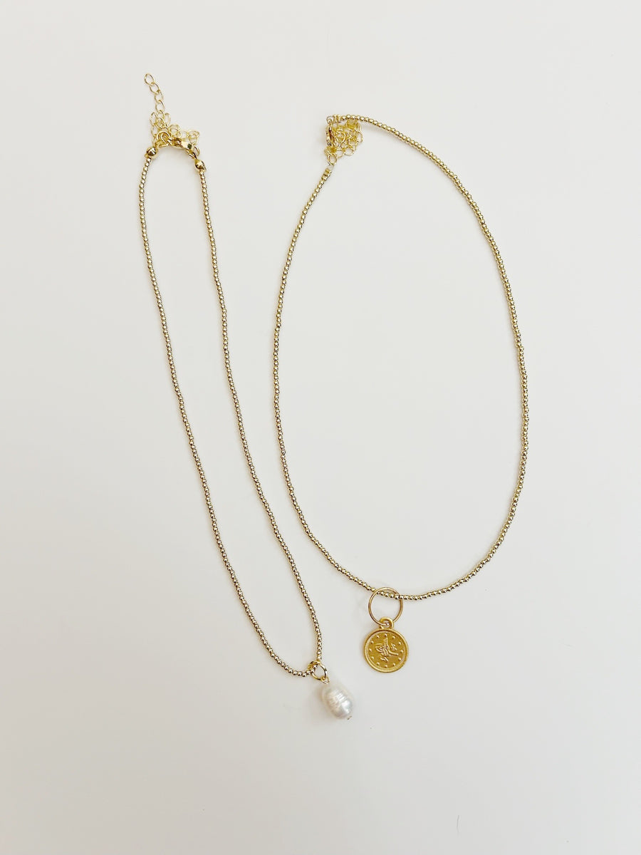 Gilded Baby Ball Necklace with Charm